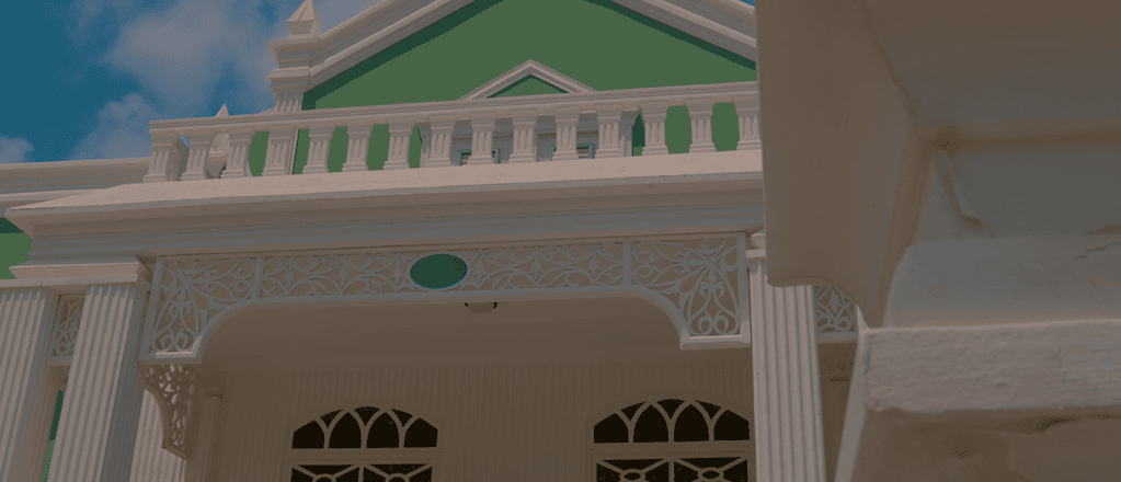 Close-up of Aruba’s City Hall balcony and Neo-Baroque architectural details.
