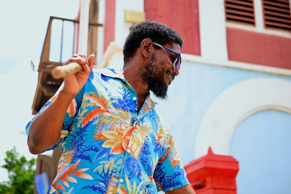 Beach Lama at Fort Zoutman in Aruba, captured in a close-up with the historic fort walls in the background.
