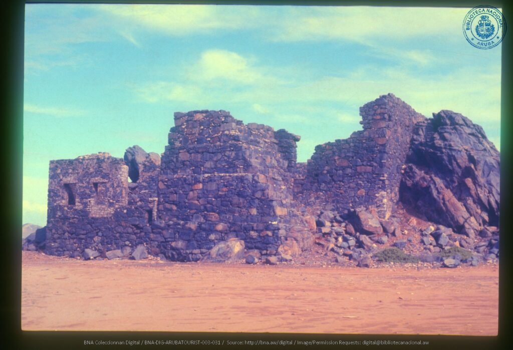 Historic photo of the Bushiribana Gold Mill ruins in Aruba, showcasing the stone structure.