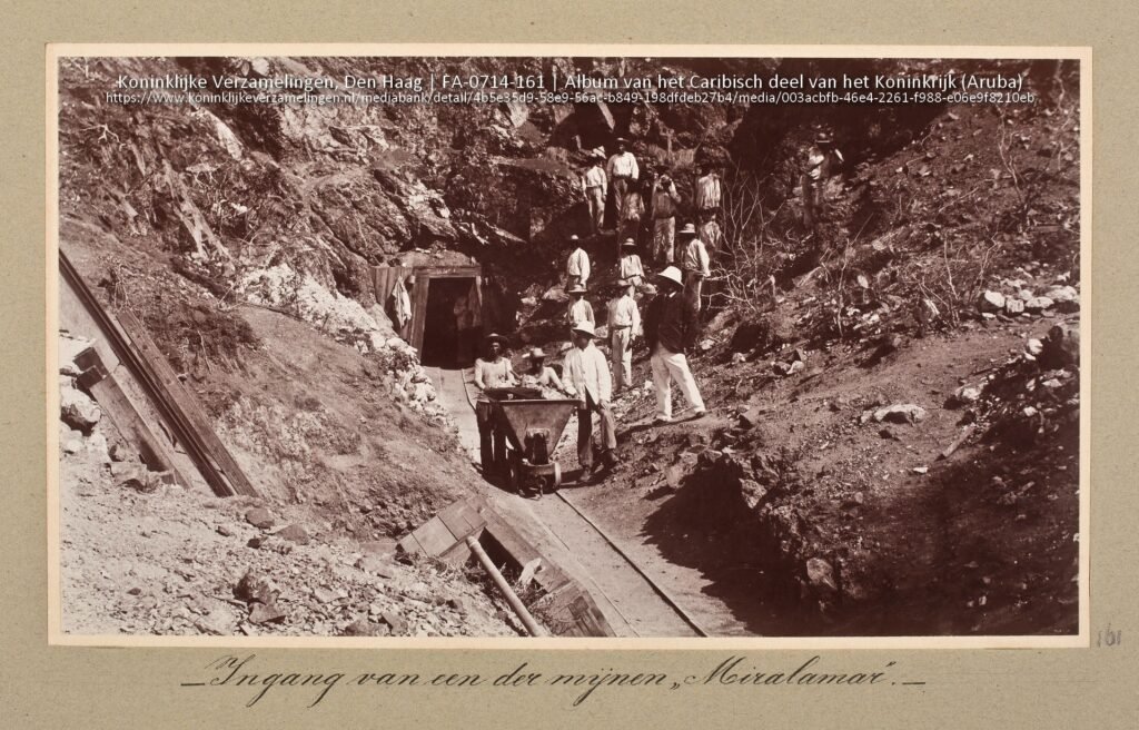 Workers at the entrance of the Miralamar gold mine in Aruba during the late 19th century.