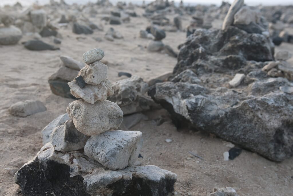 Stone and rock stacks near Bushiribana Gold Mill, symbolizing wishes left by visitors.
