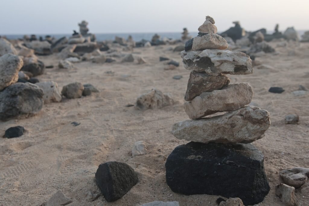 Stacked stones along the coast near Bushiribana ruins in Aruba.