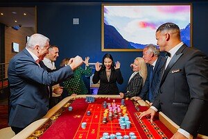 Exciting casino gambling game at Djis Pa Hari with guests and dealer enjoying a lively night of fun and betting.